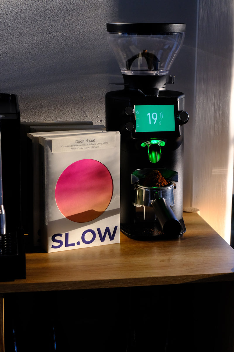 Disco Biscuit box beside the grinder