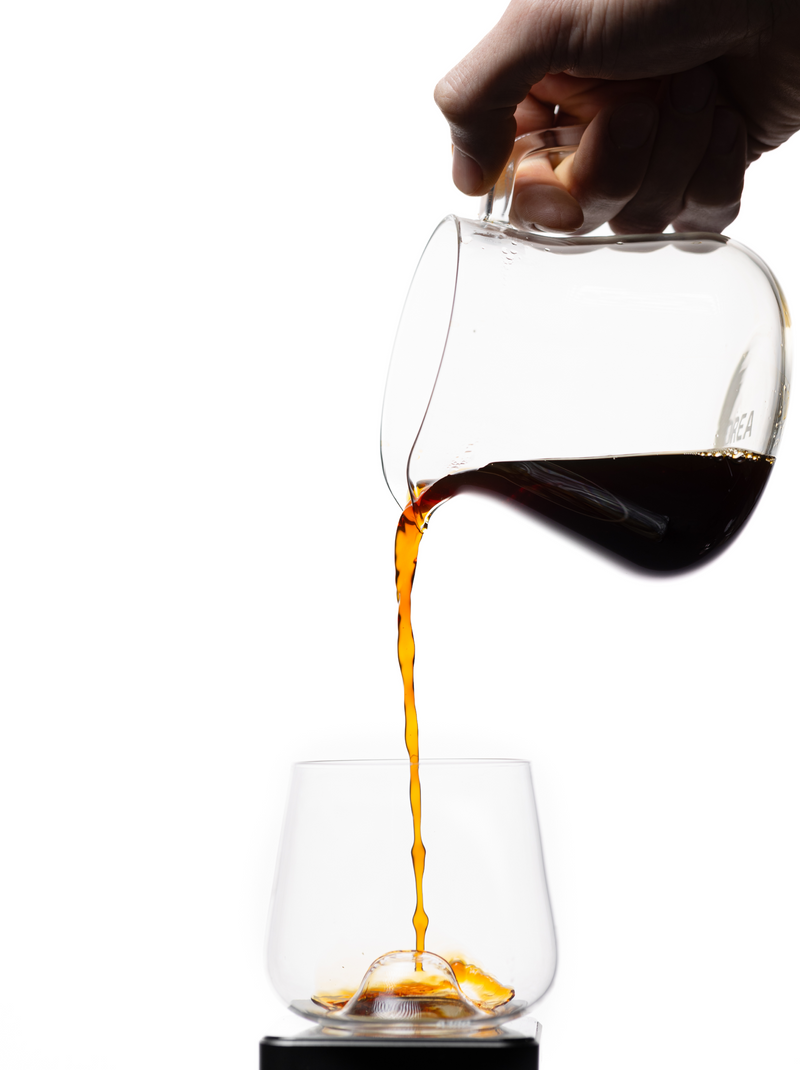 Orea Sensory Carafe pouring filter coffee into a glass