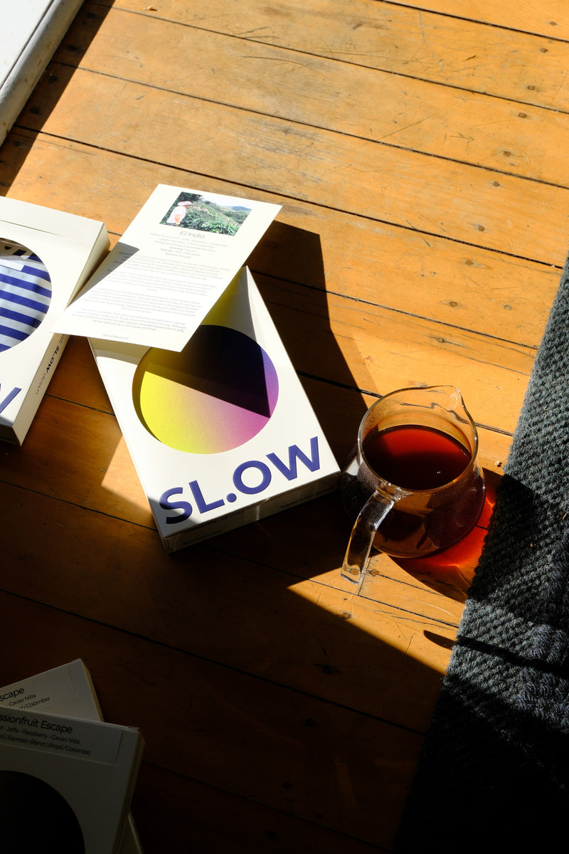 Passionfruit Escape box and brewed cup in window light