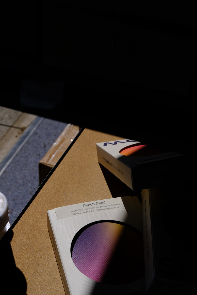 Peach Petal box in a shaft of sunlight